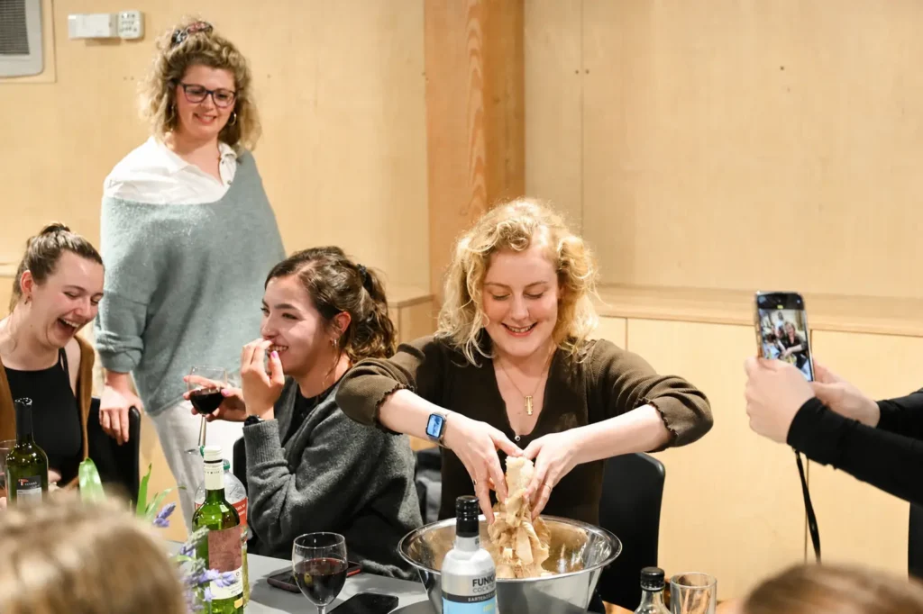eat club supper club group cooking event in action, people cooking together